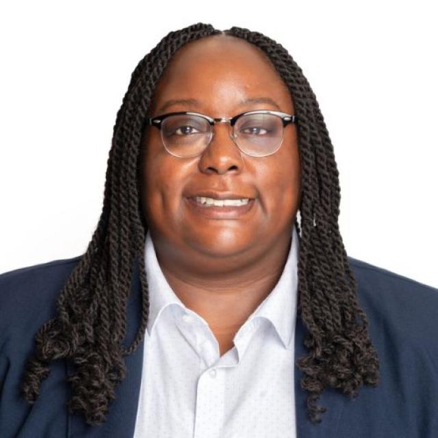 a portrait of a smiling woman in a suit